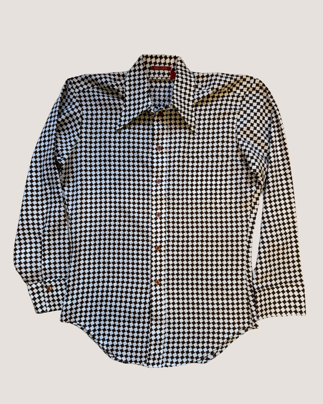 Black and white checkered shirt on a light gray background