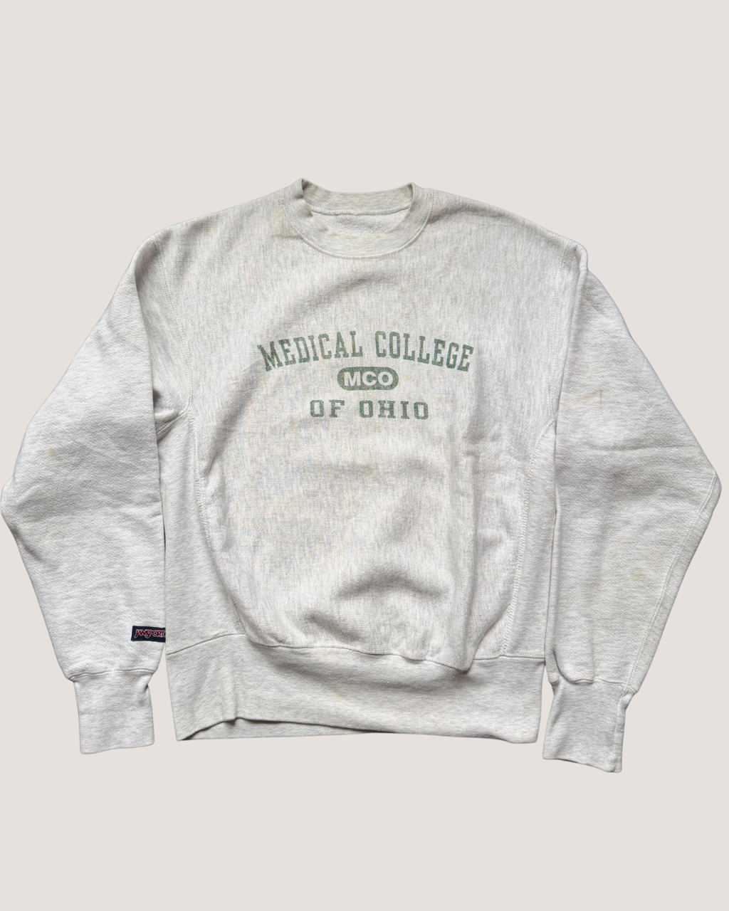 Gray sweatshirt with 'Medical College of Ohio' text on a light gray background