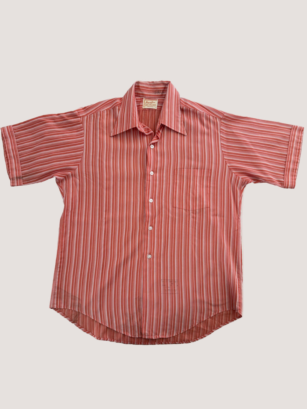 Red and white striped shirt on a light gray background