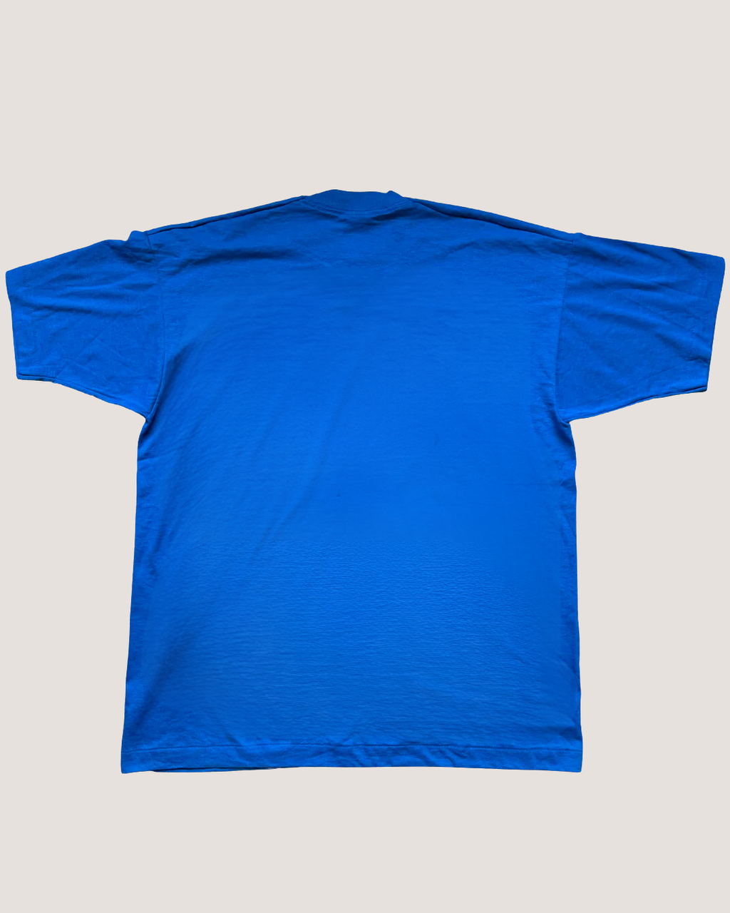 Blue t-shirt on a light gray background