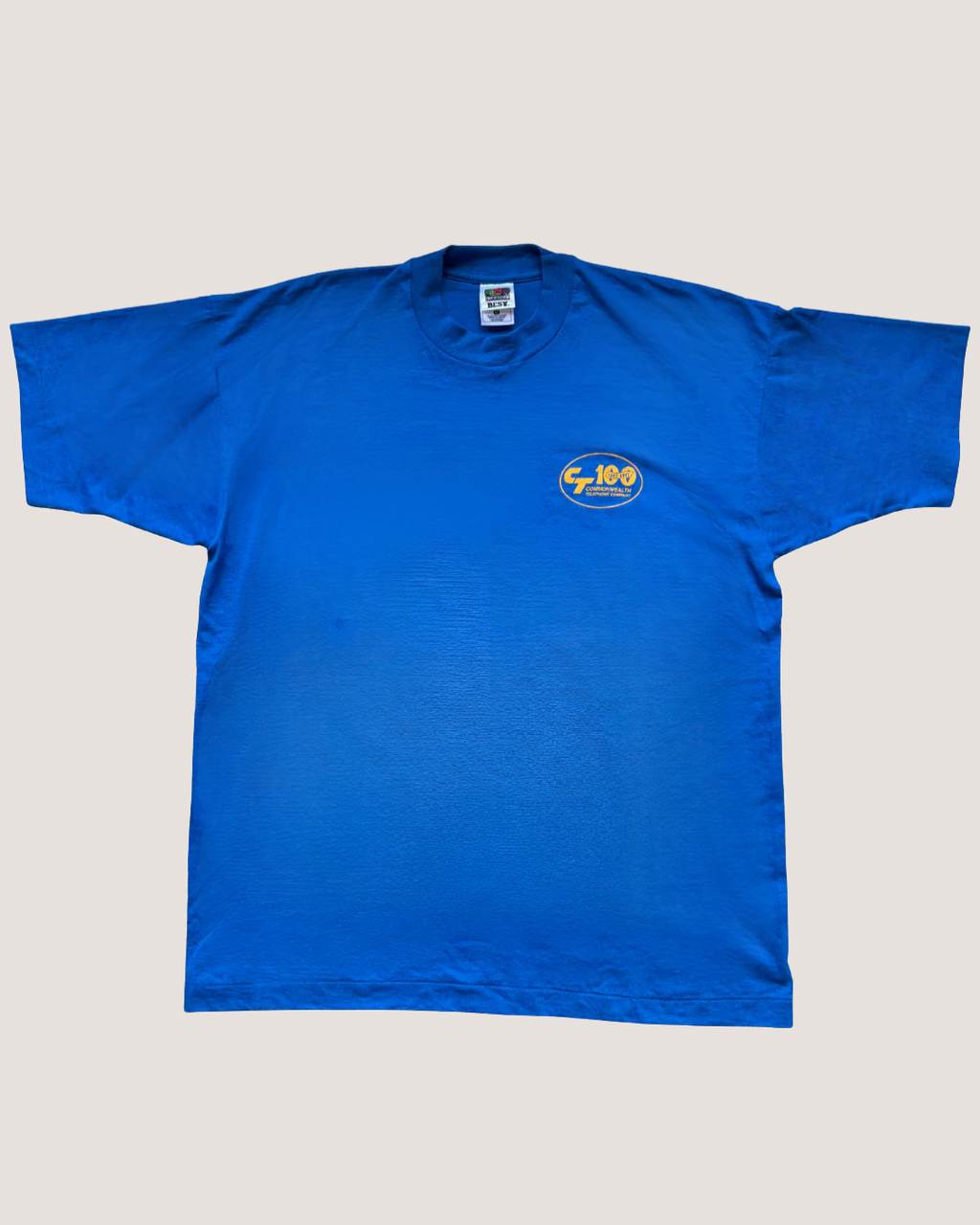 Blue t-shirt with a logo on a light gray background