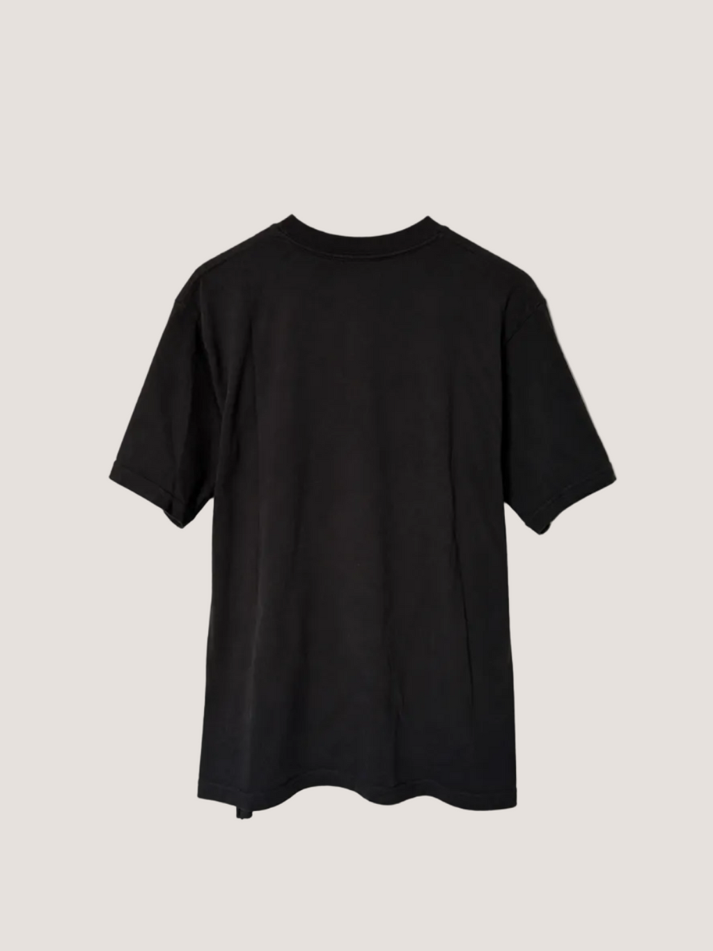 Black t-shirt on a light beige background