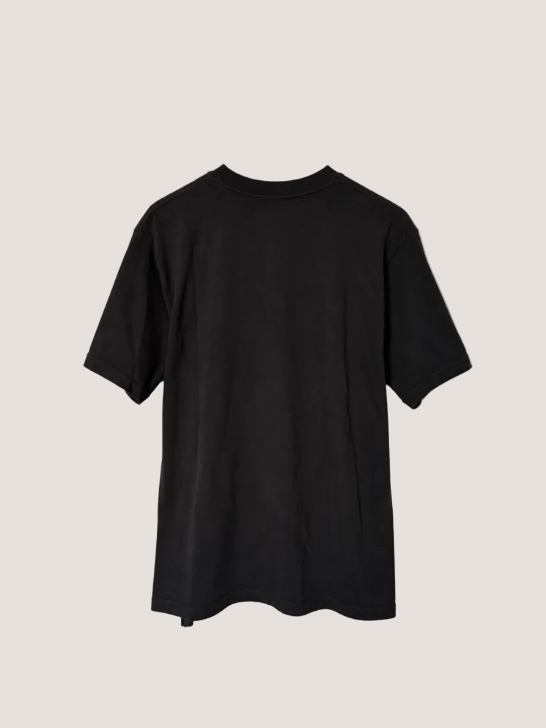 Black t-shirt on a light beige background