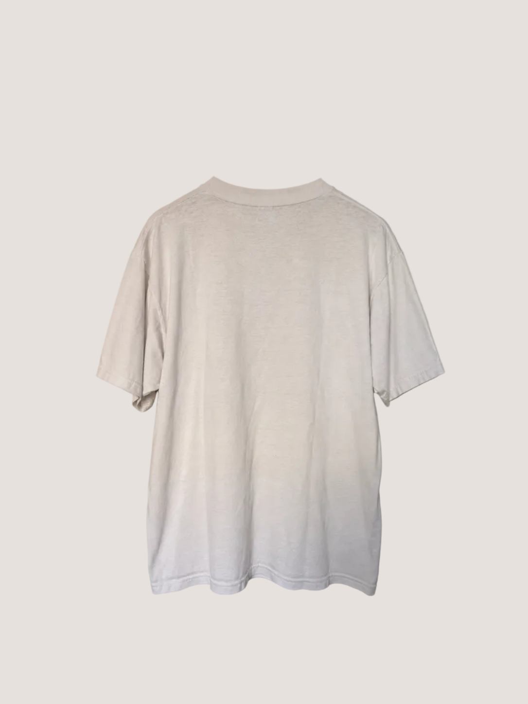 White t-shirt on a beige background