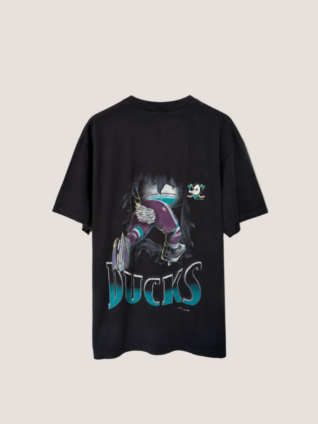 Black t-shirt with graphic design and 'Ducks' text on a plain background