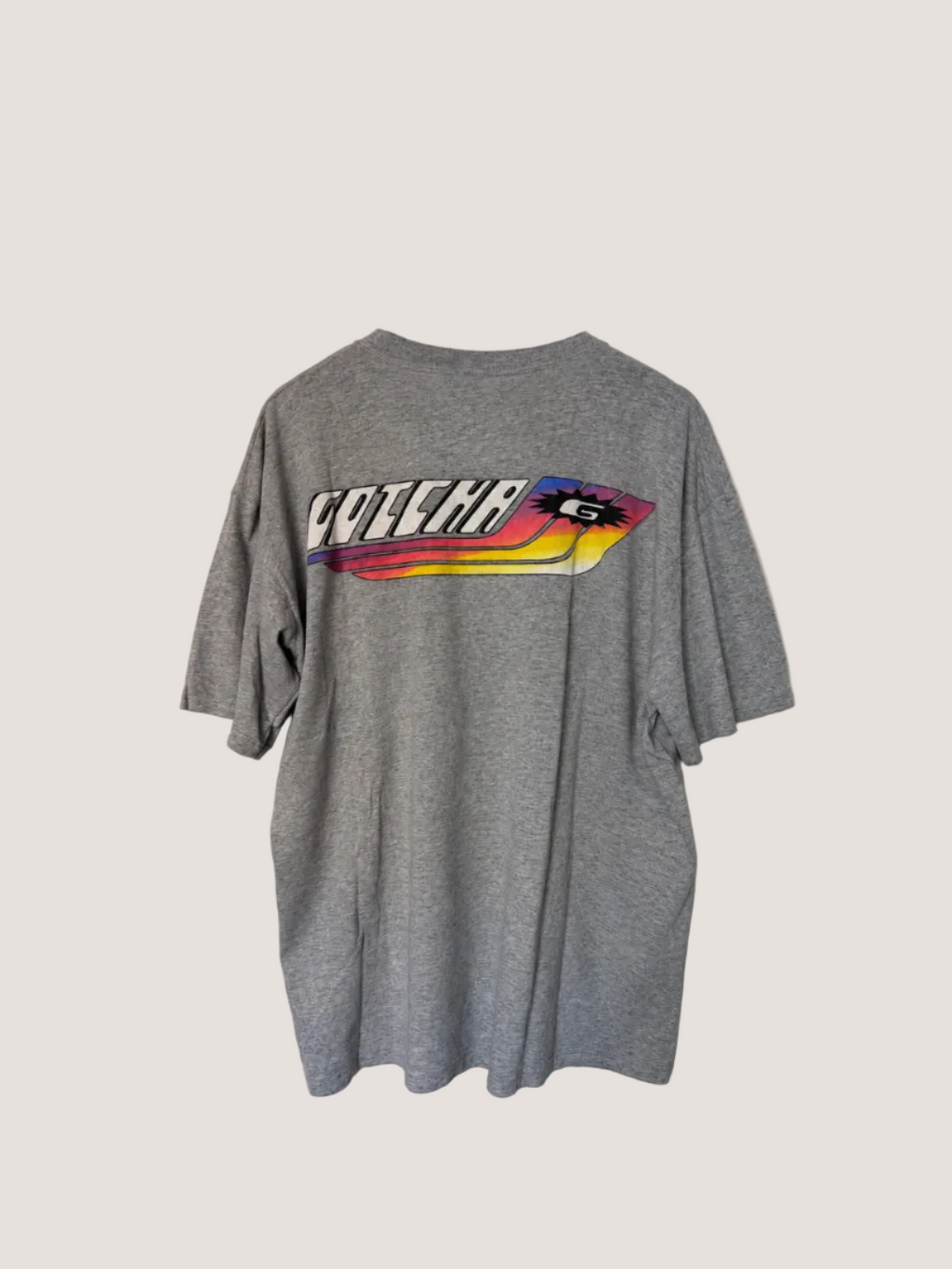 Gray t-shirt with a colorful graphic and text on the back, displayed against a plain background.