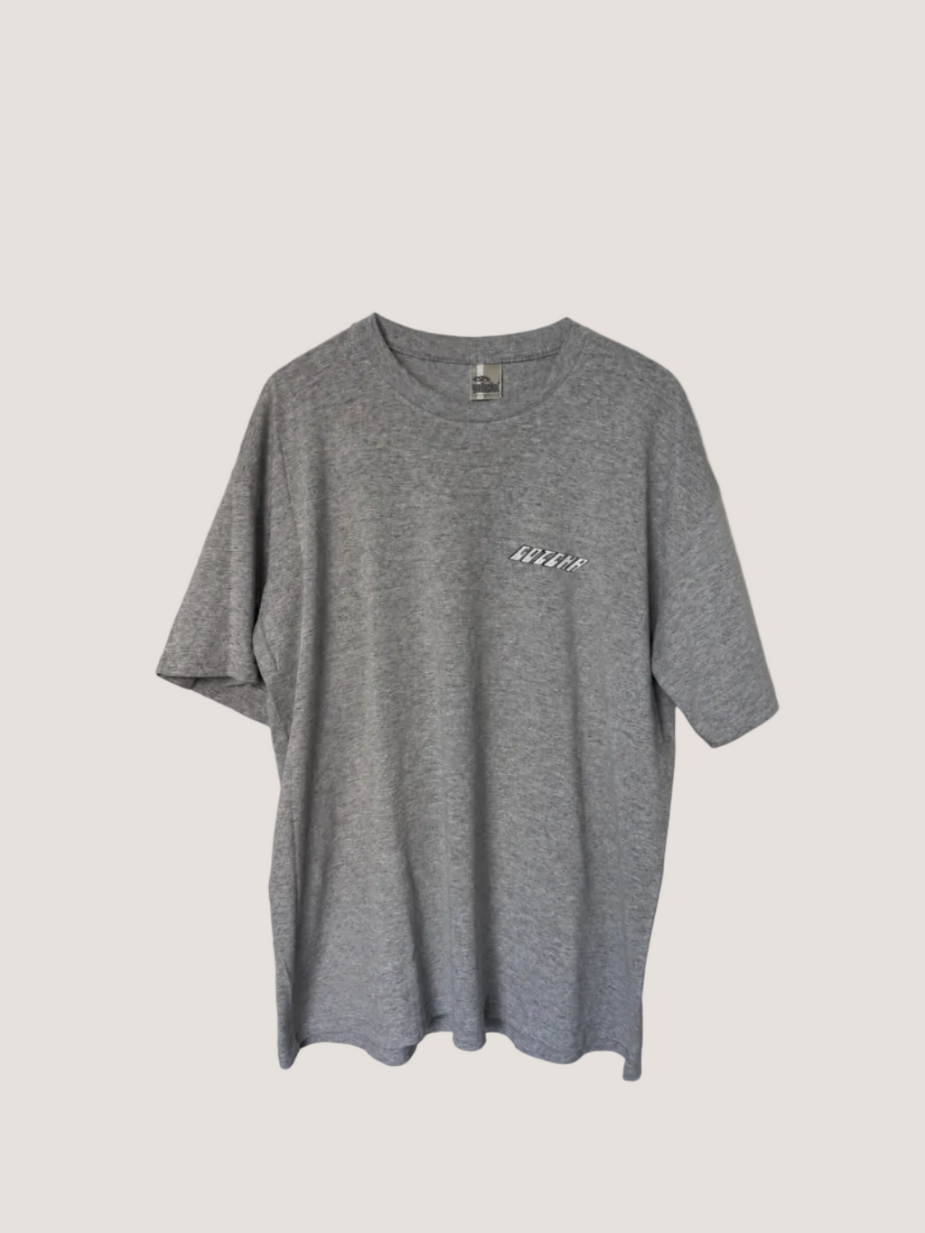 Gray t-shirt with a logo on a plain background
