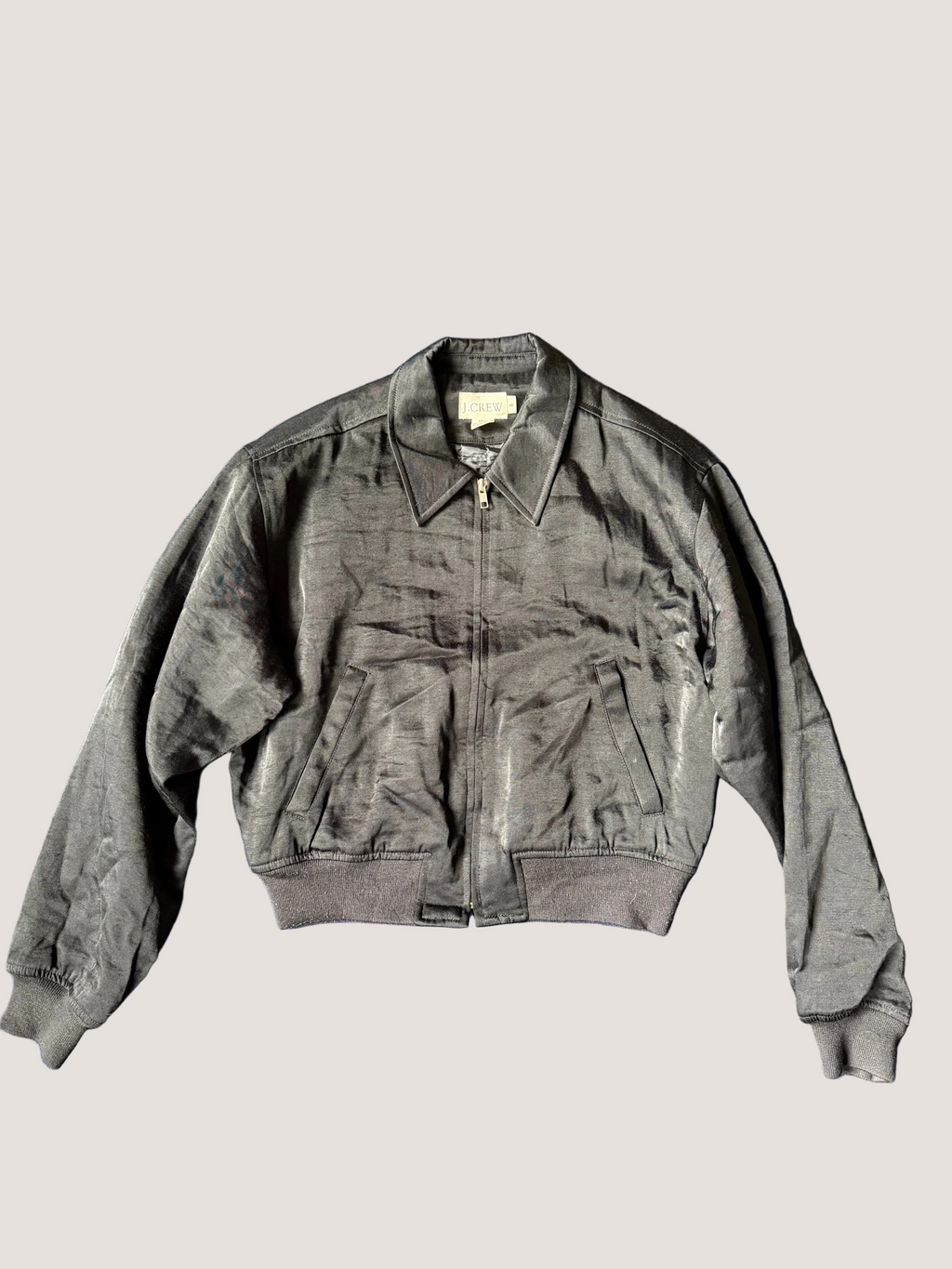 Gray jacket on a blue fabric background