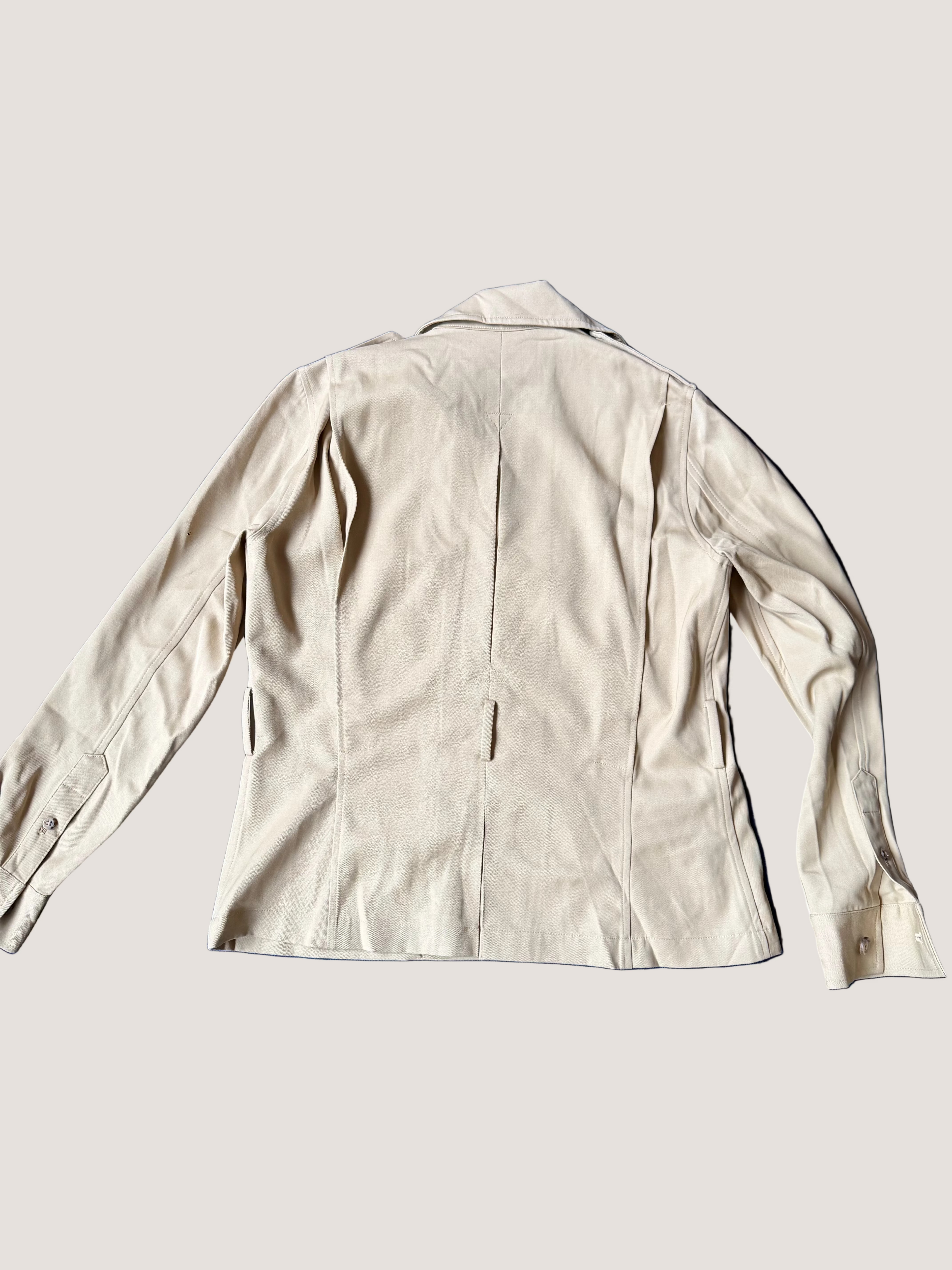 Beige jacket on a blue fabric background