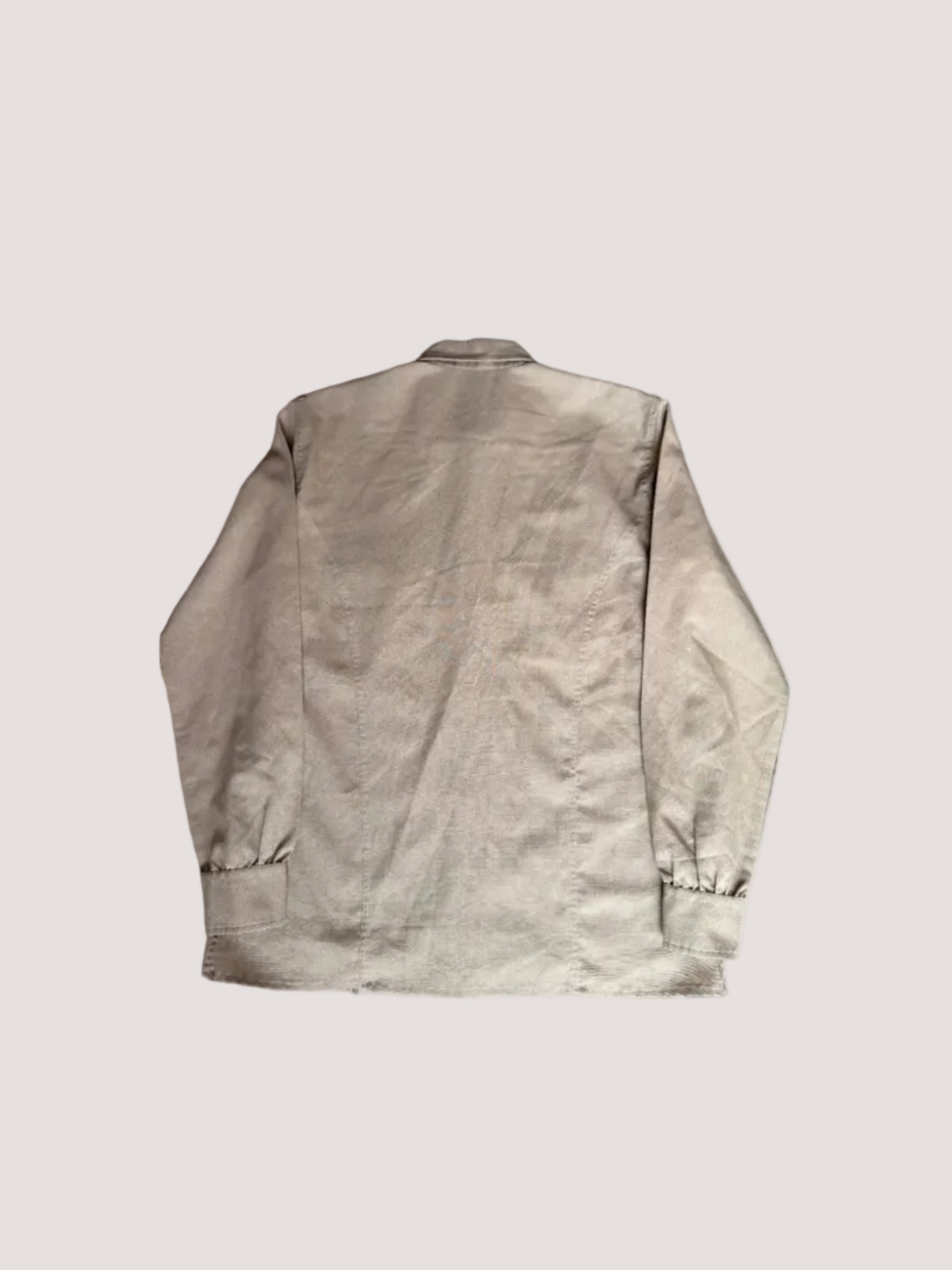 Beige jacket on a textured surface