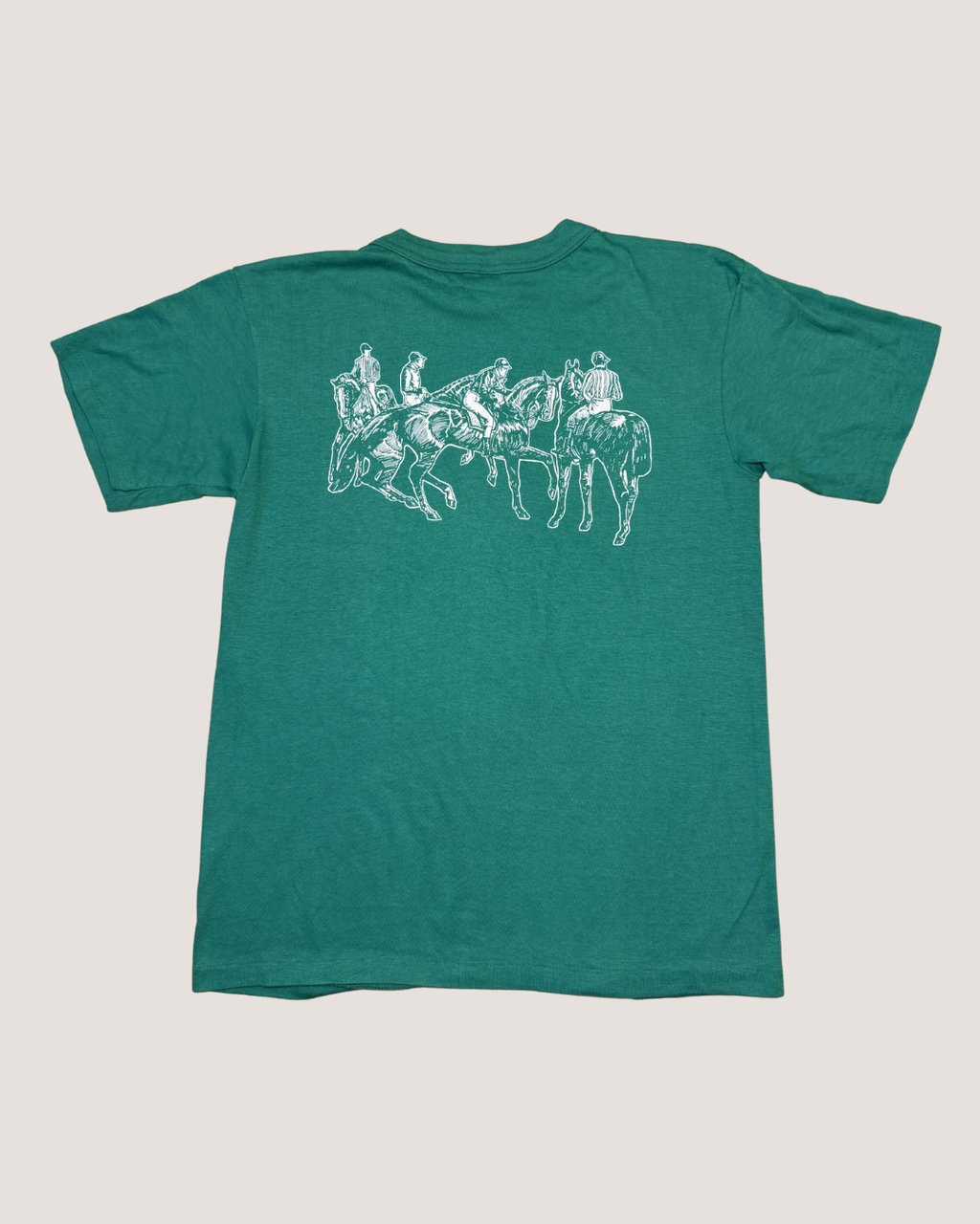 Green t-shirt with white graphic design on a light gray background