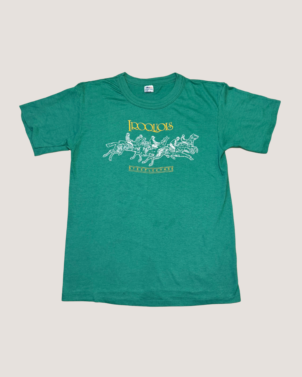 Green t-shirt with graphic design and text on a light gray background