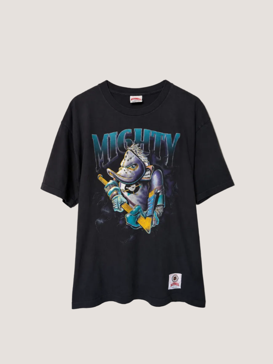 Black t-shirt with a graphic design of a fish holding skis and the word 'MIGHTY' on a plain background.