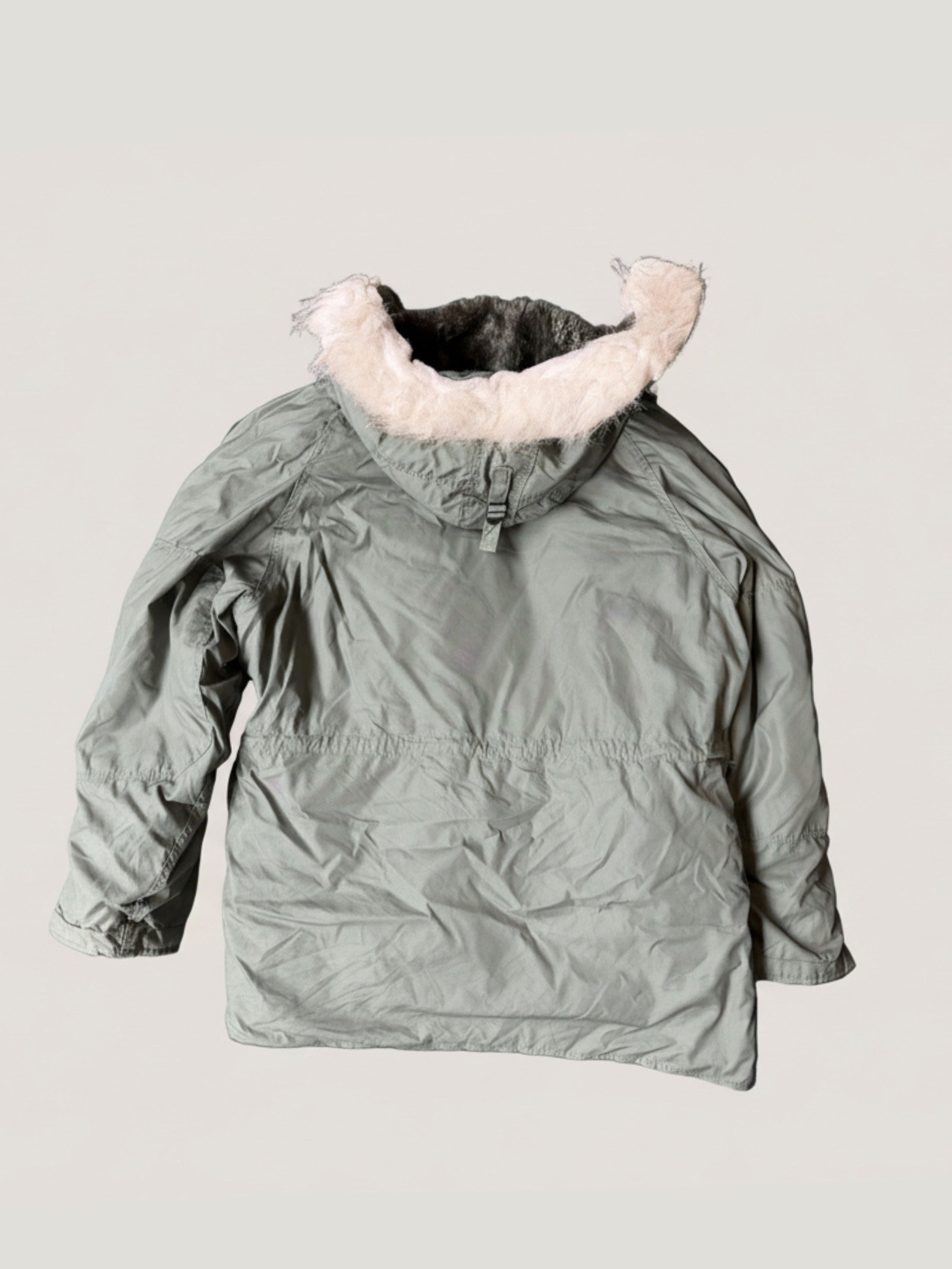 Green N-3B-Parka winter jacket with fur-lined hood on a light gray background