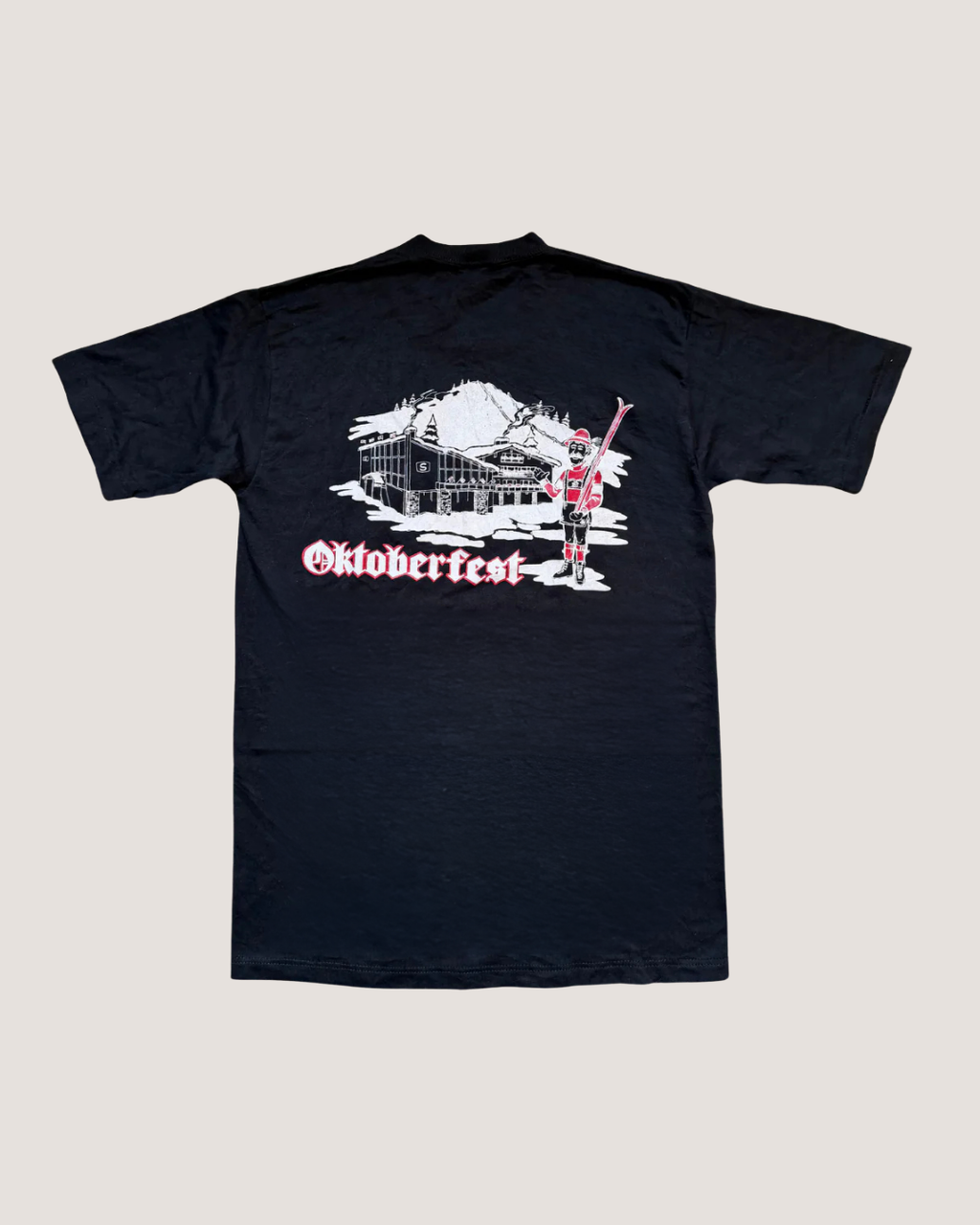 Black t-shirt with Oktoberfest graphic on a light gray background