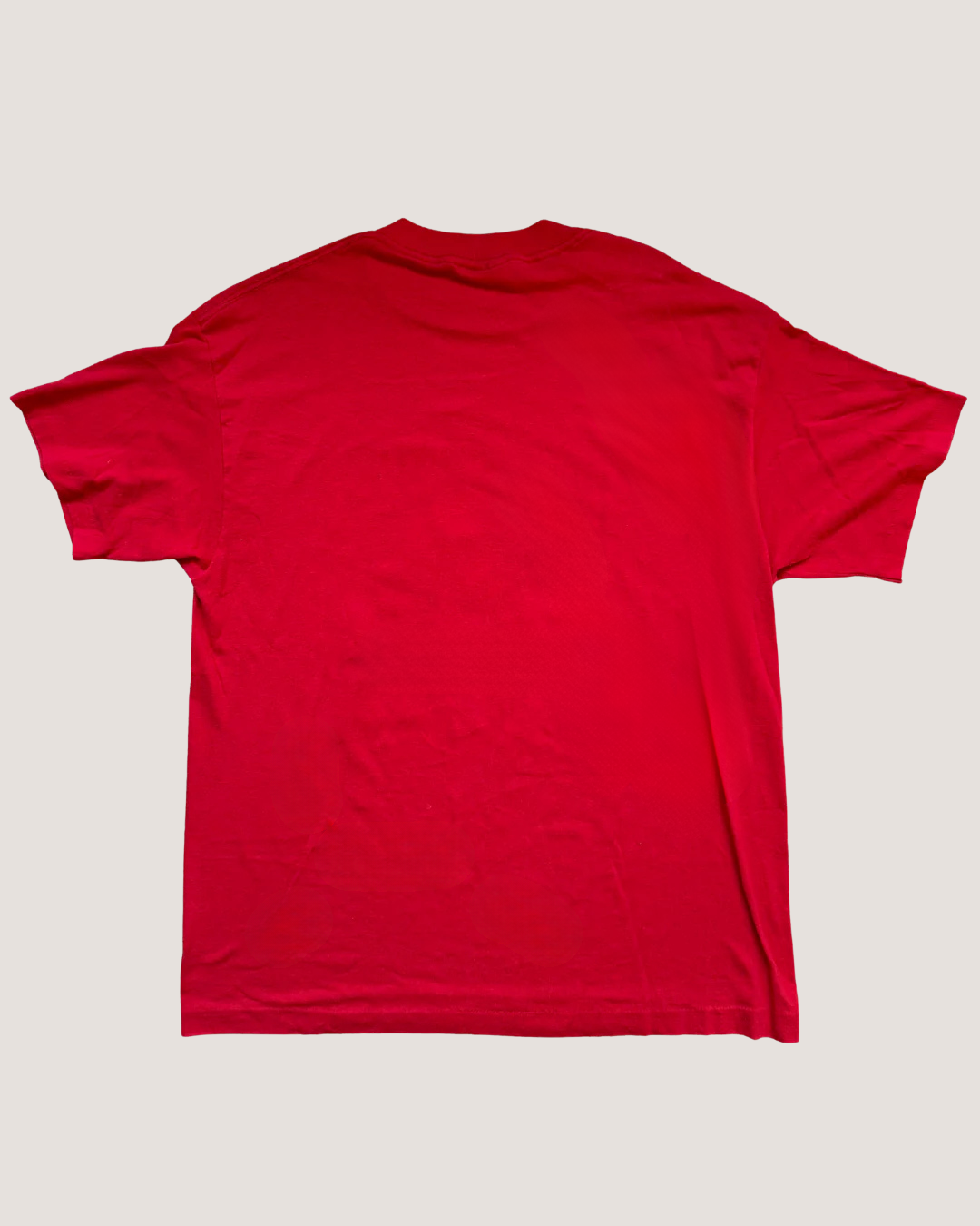Red t-shirt on a light gray background