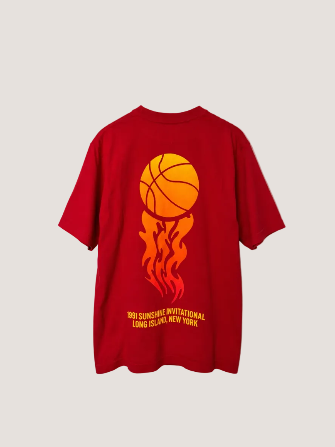 Red t-shirt with a basketball design and text on the back