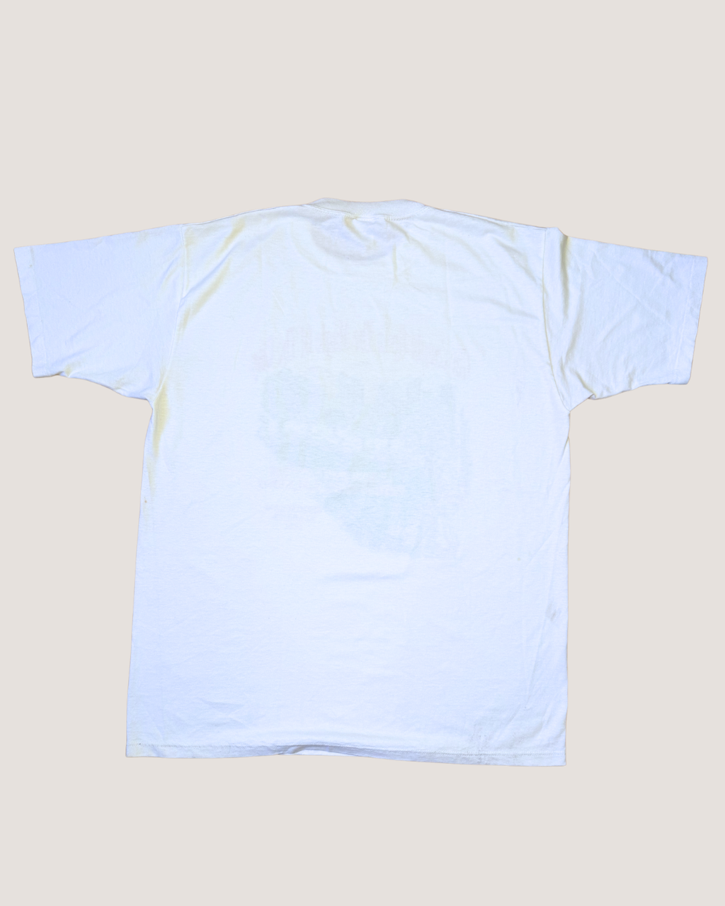 Plain light blue t-shirt on a beige background