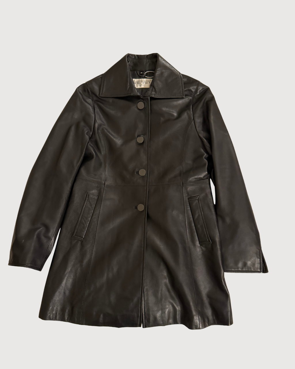 Black leather coat on a light gray background