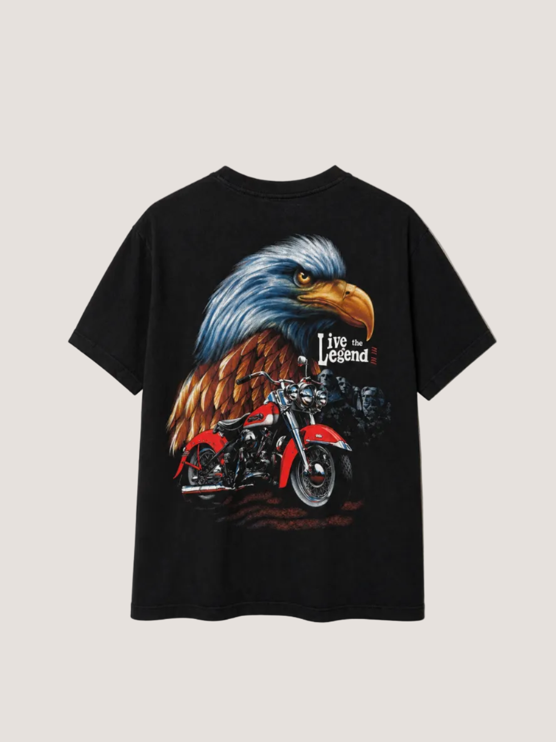 Black t-shirt with an eagle and motorcycle graphic on a beige background