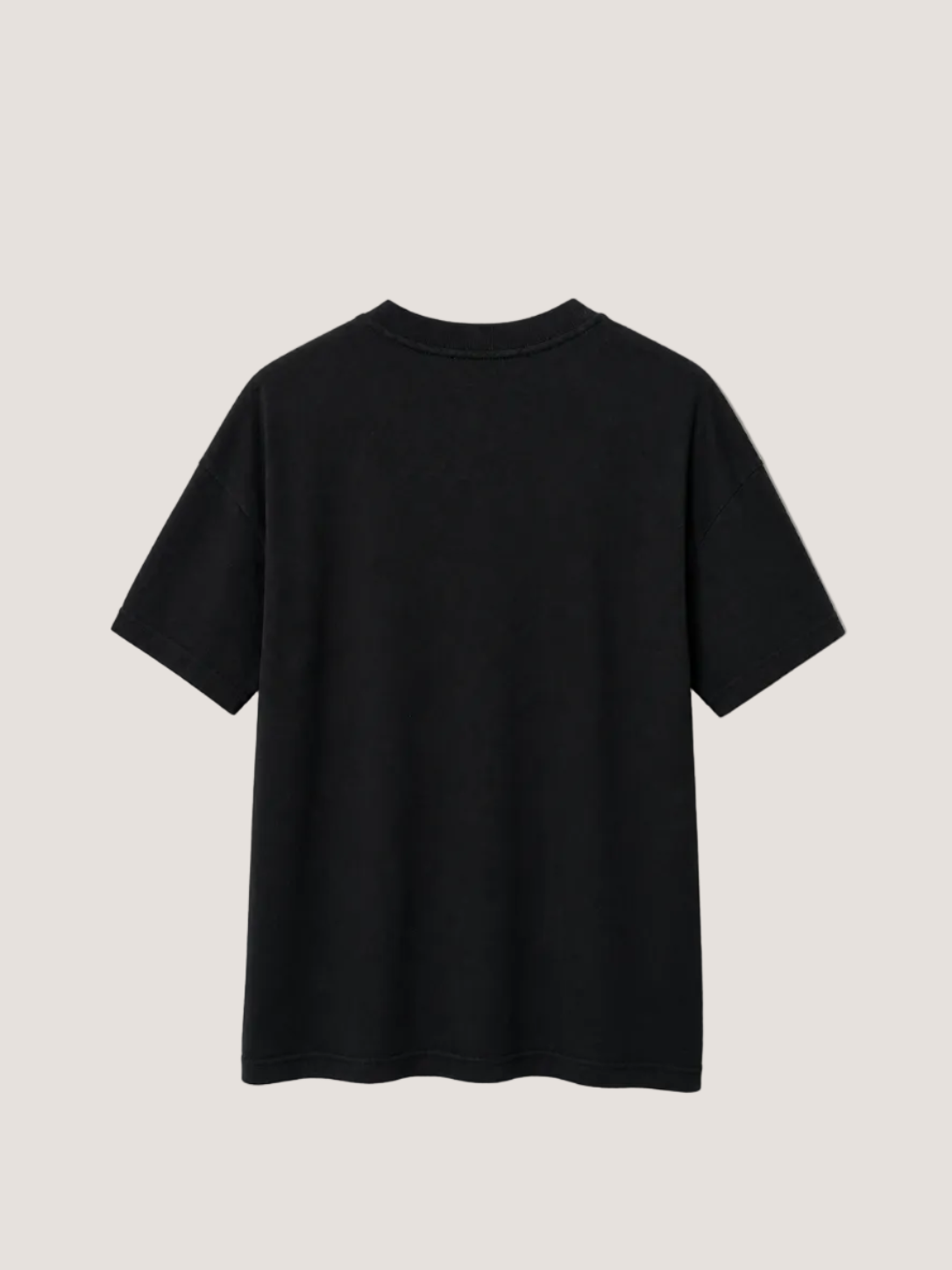 Black t-shirt on a beige wall